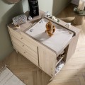 Multi-position changing table for a freestanding baby dresser